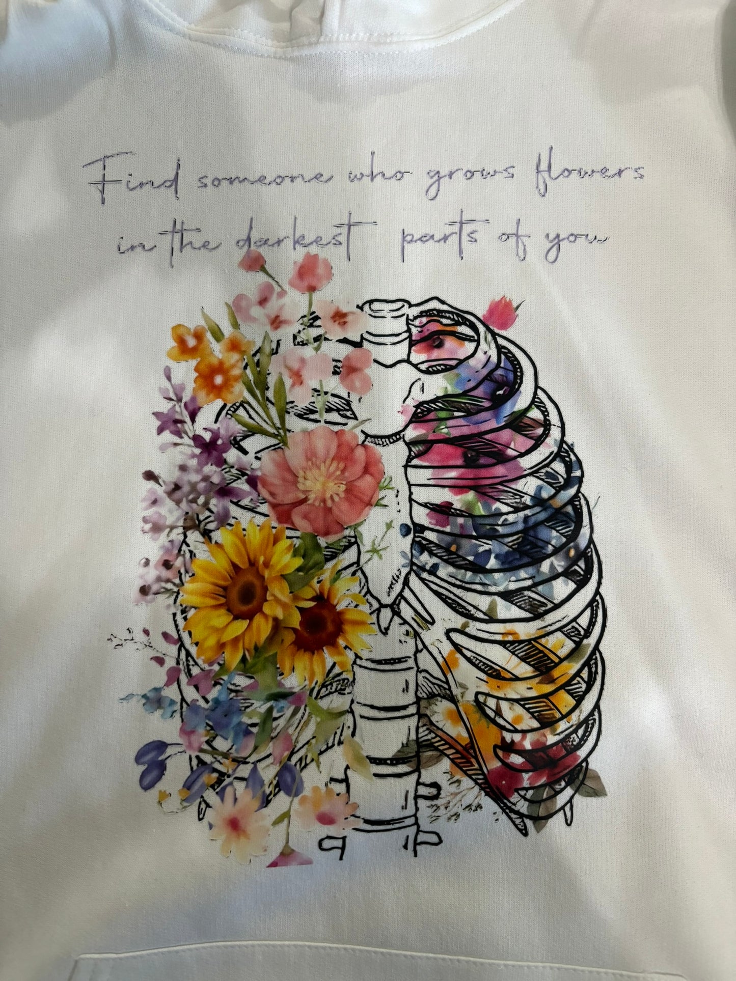Find someone who grows flowers in the darkest parts of you hoodie