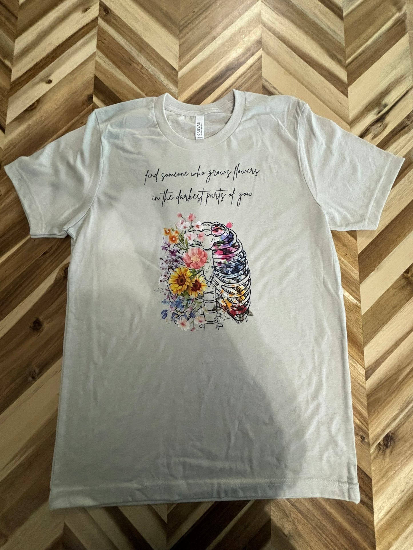 Find someone who grows flowers in the darkest parts of you t-shirt