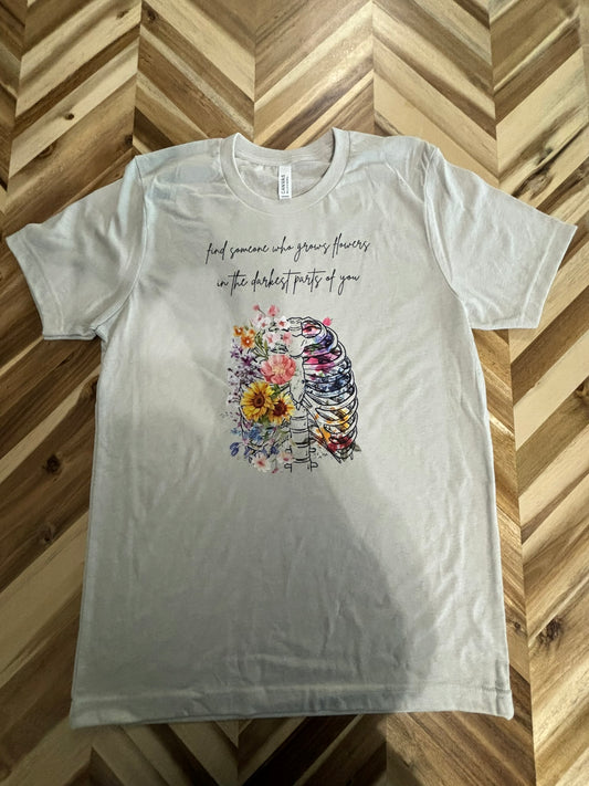 Find someone who grows flowers in the darkest parts of you t-shirt
