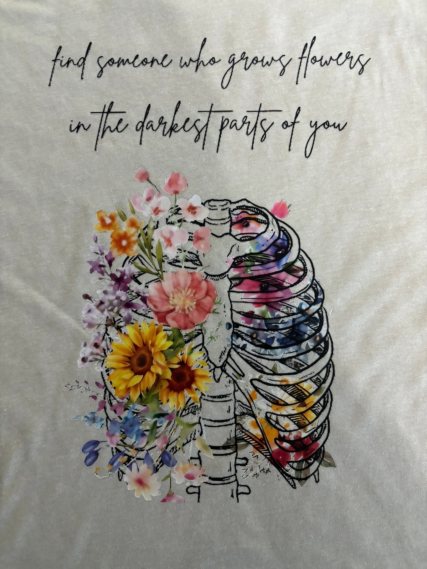 Find someone who grows flowers in the darkest parts of you t-shirt