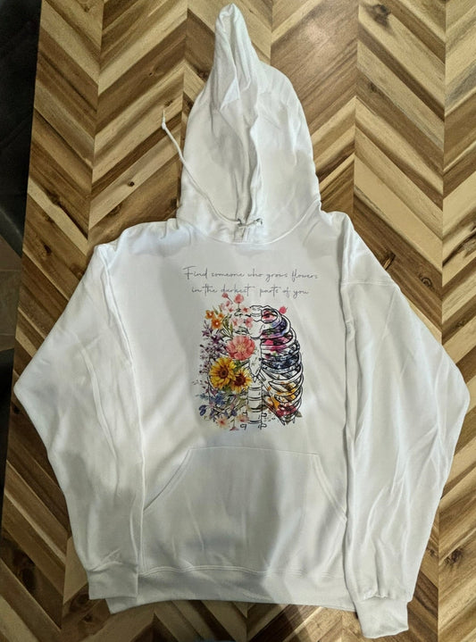 Find someone who grows flowers in the darkest parts of you hoodie