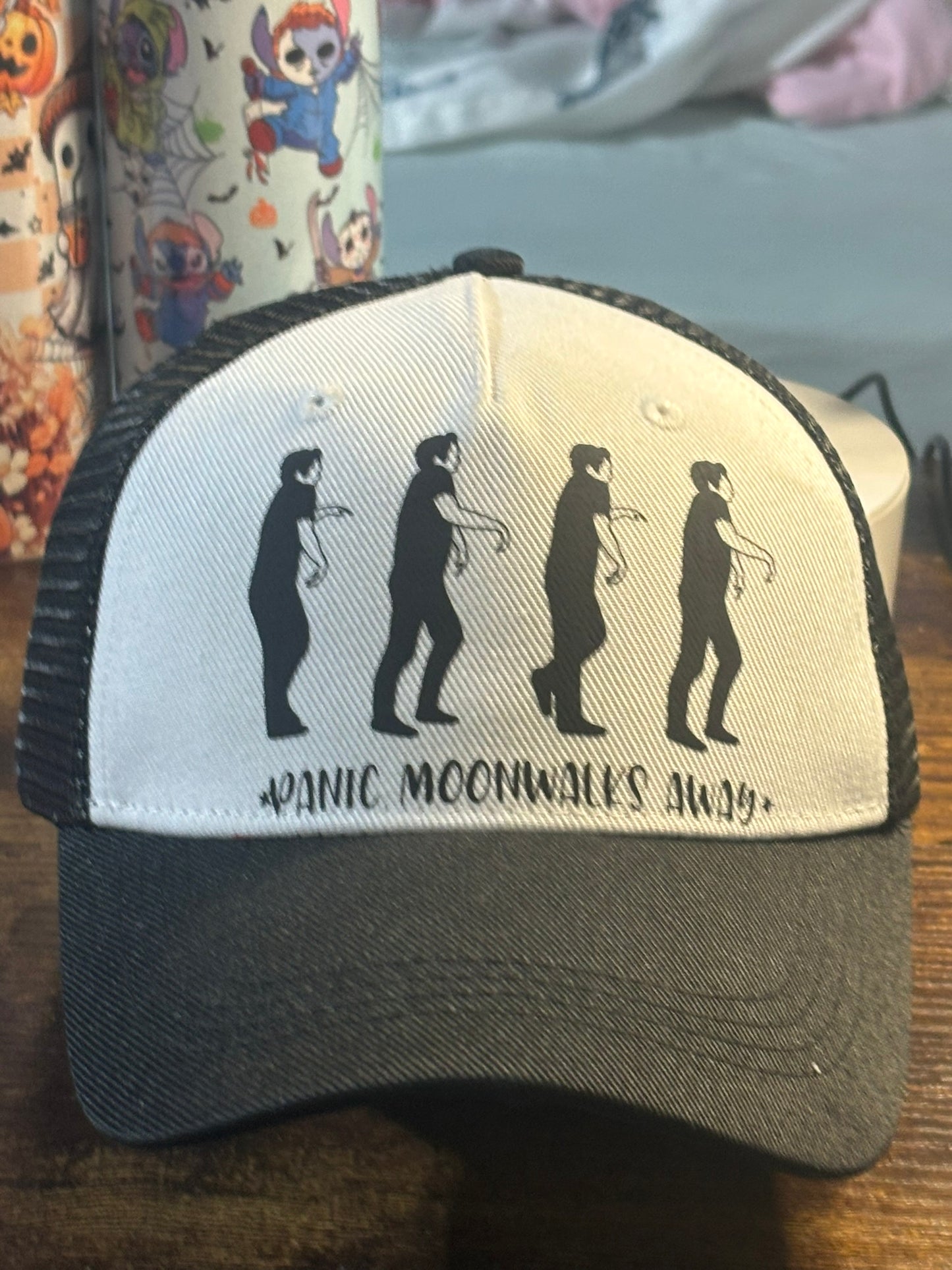 Panic Moonwalks Away Trucker Hat