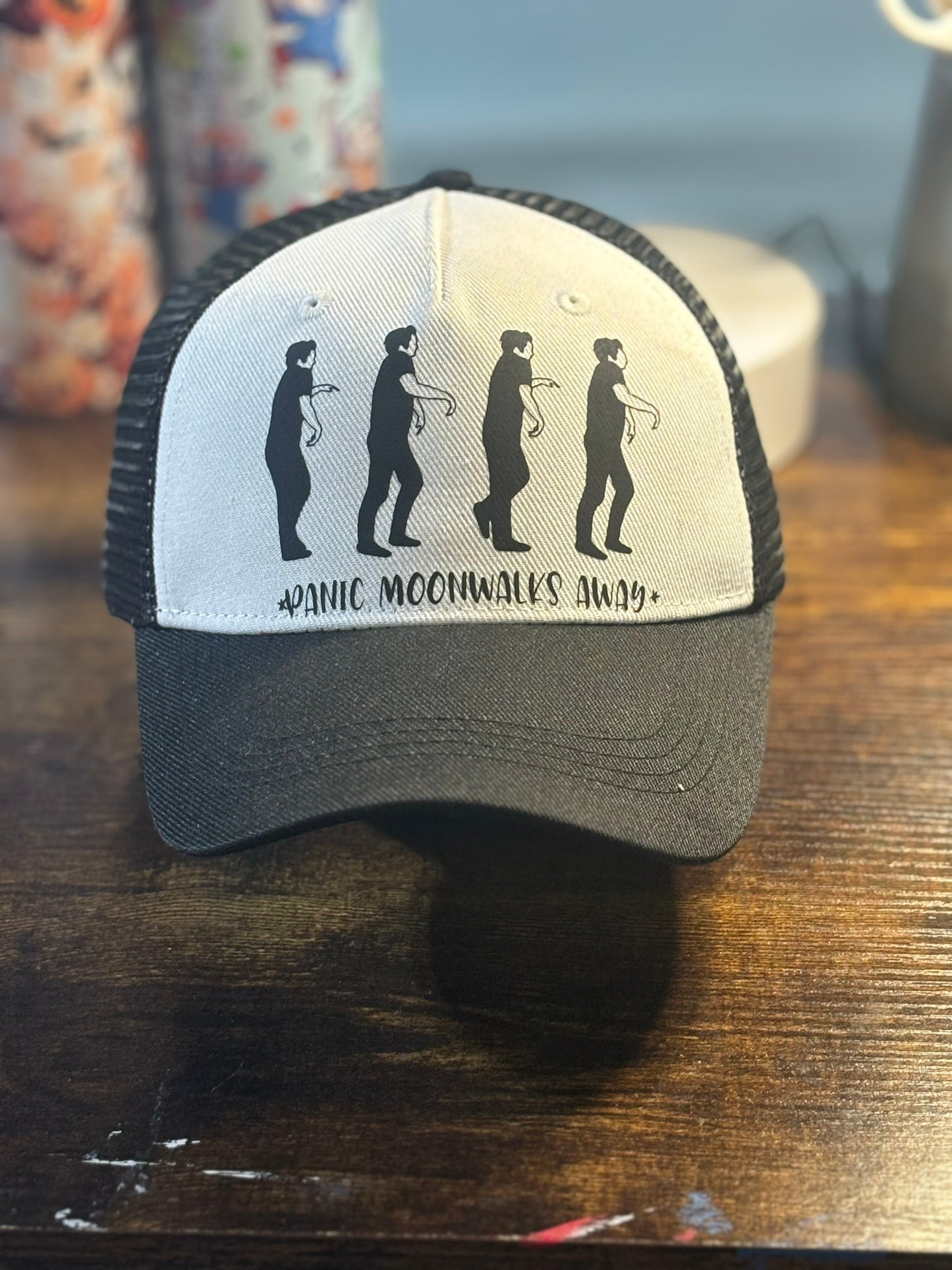 Panic Moonwalks Away Trucker Hat