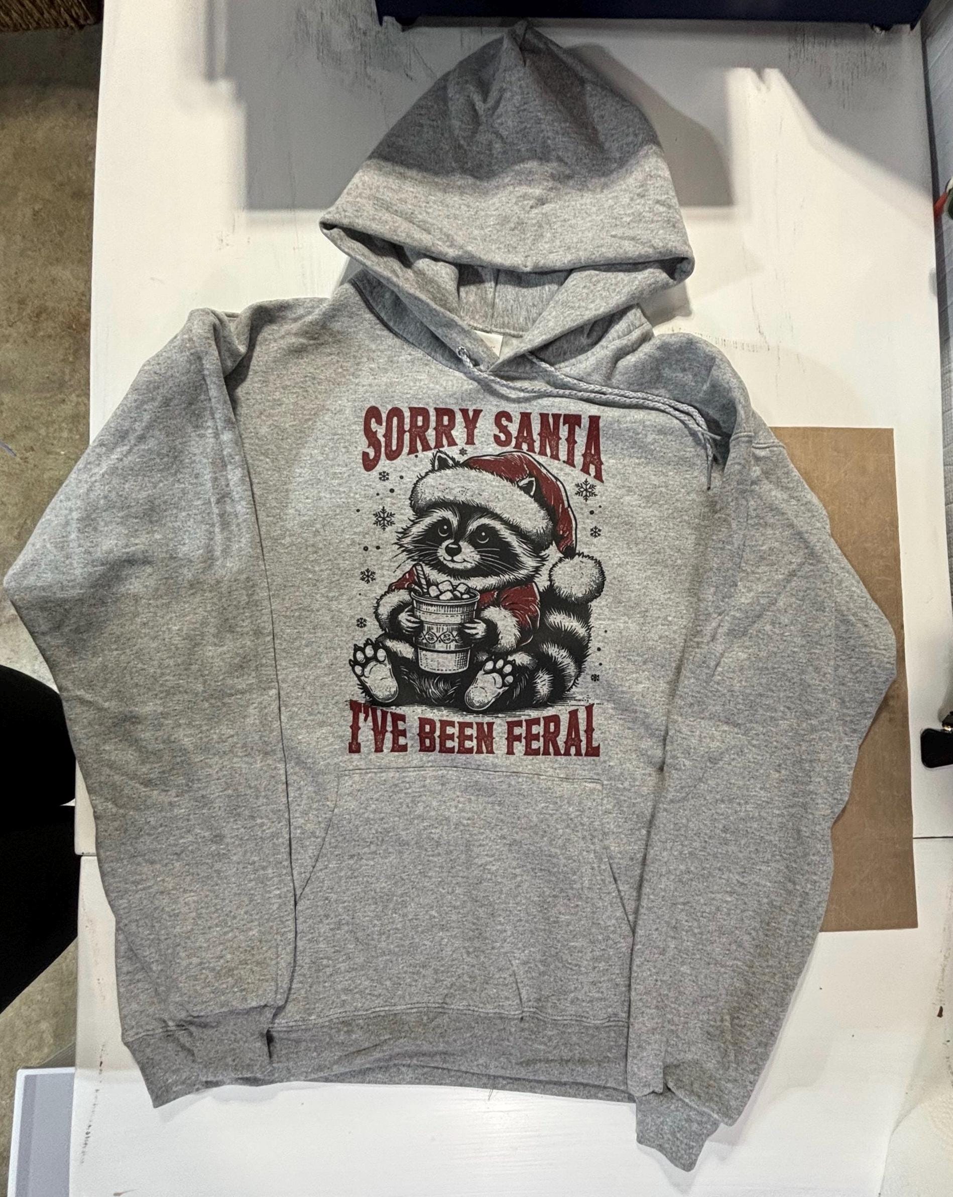 Sorry Santa I’ve been feral Christmas raccoon hoodie